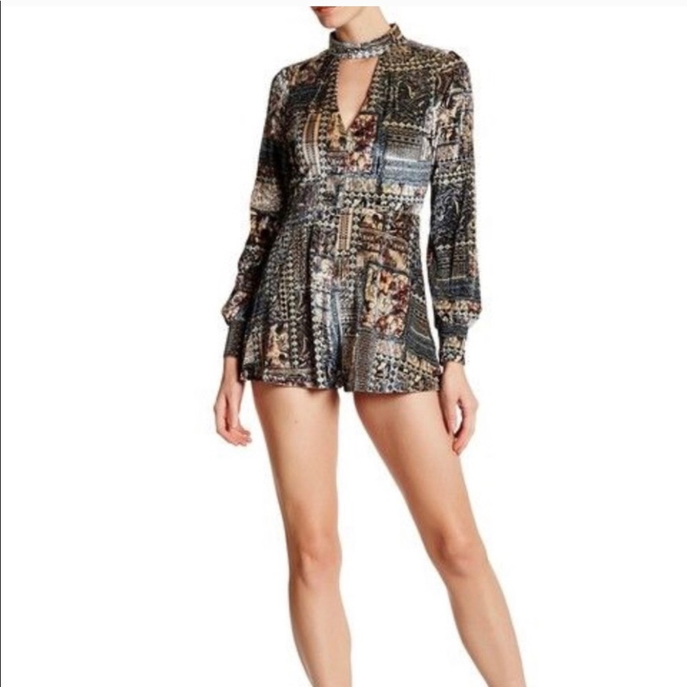 NWT. Colorful long sleeve romper